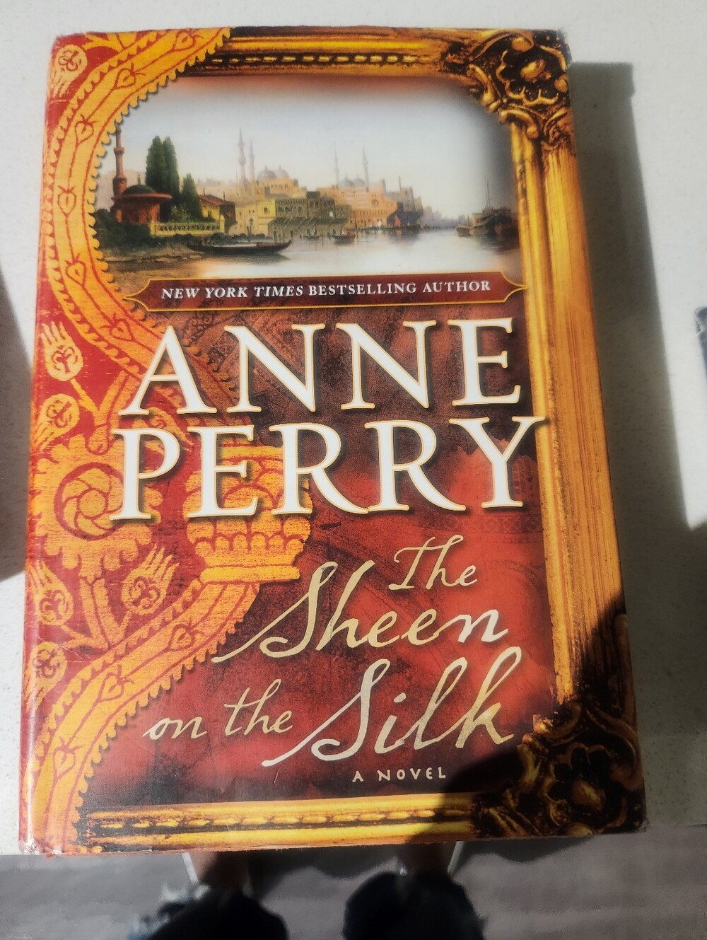 Anne Perry "The Sheen on the Silk" - Red & Gold Hardcover Novel